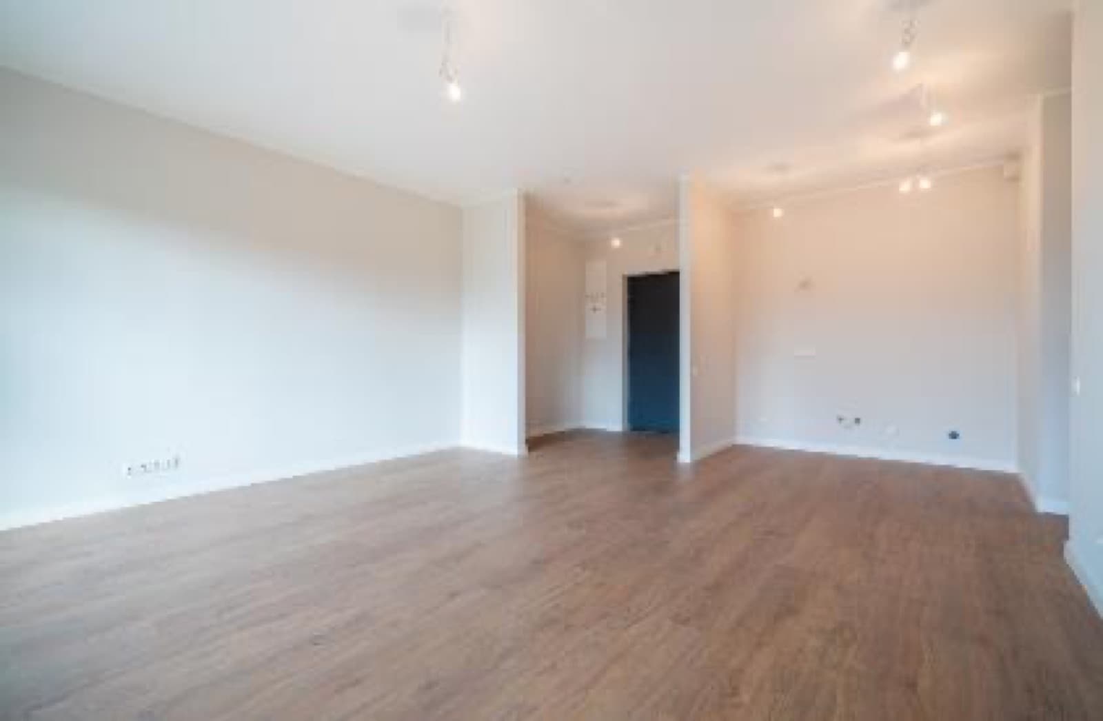 IRIS Šampēteris, open-plan living space.